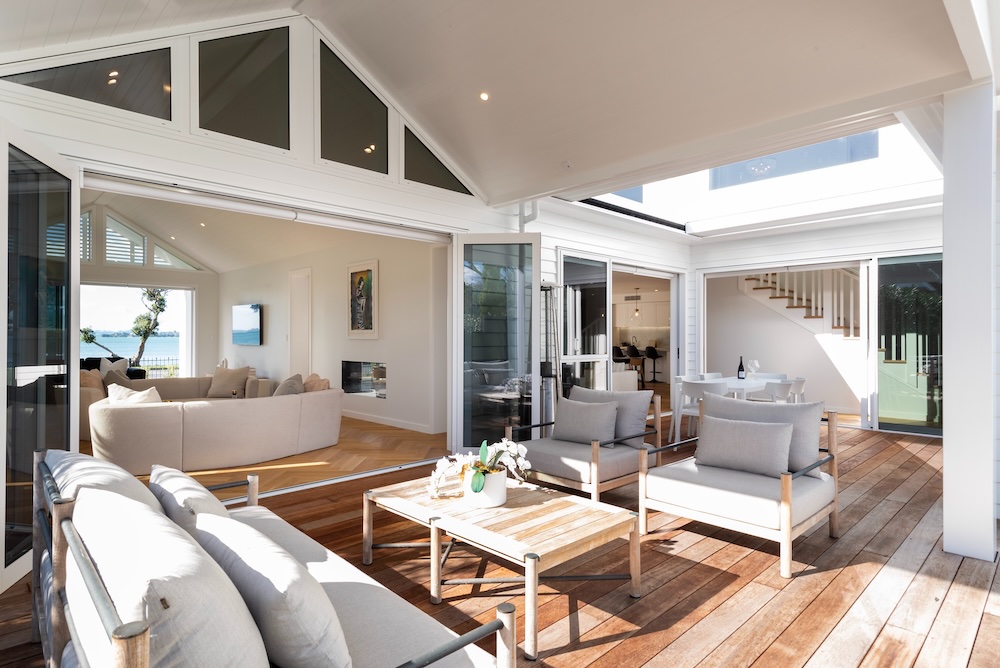 Outdoor living and deck area of architectural home built by Metro Homes Auckland