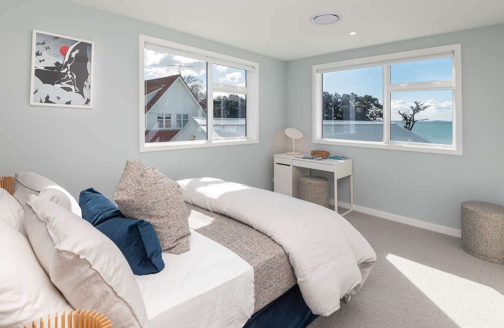 Bedroom in architecturally designed new home by Metro Homes construction, Auckland